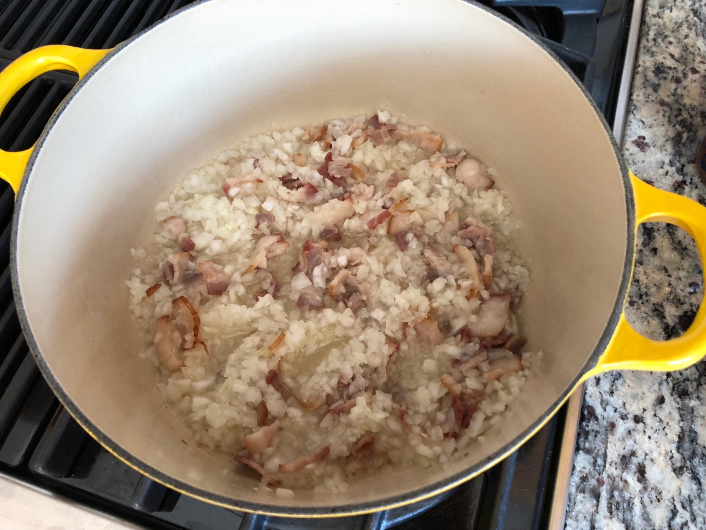 Cooking the bacon and onions