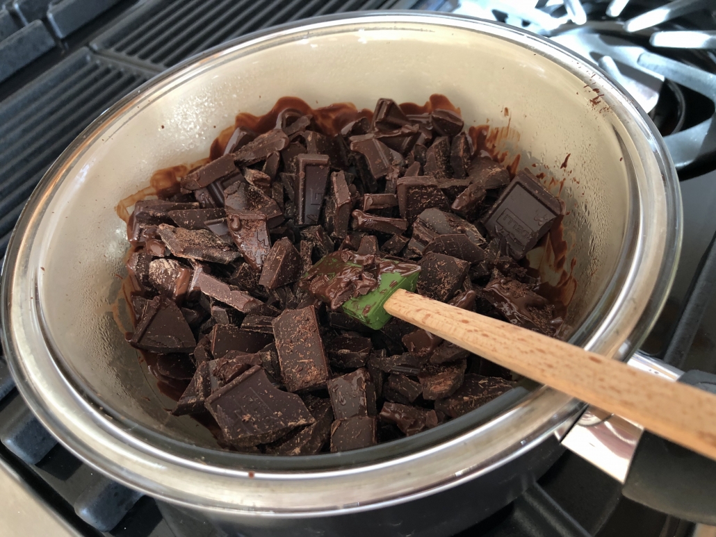 Melting the chocolate for the hazelnut chocolate nougat