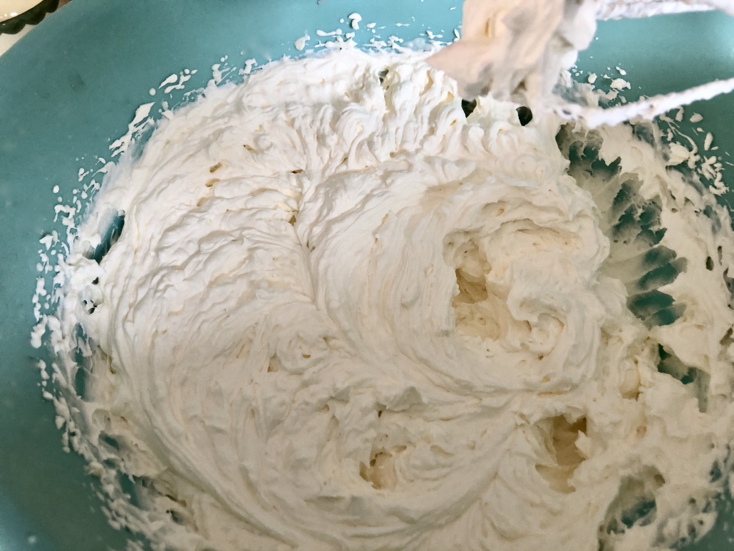 Beating the whipping cream for the Hazelnut Cream Cake