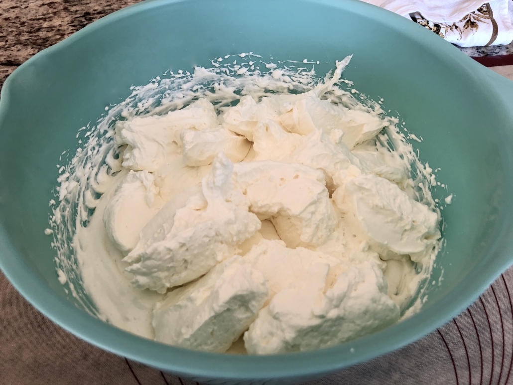 Mixing cheese mixture and whipped cream